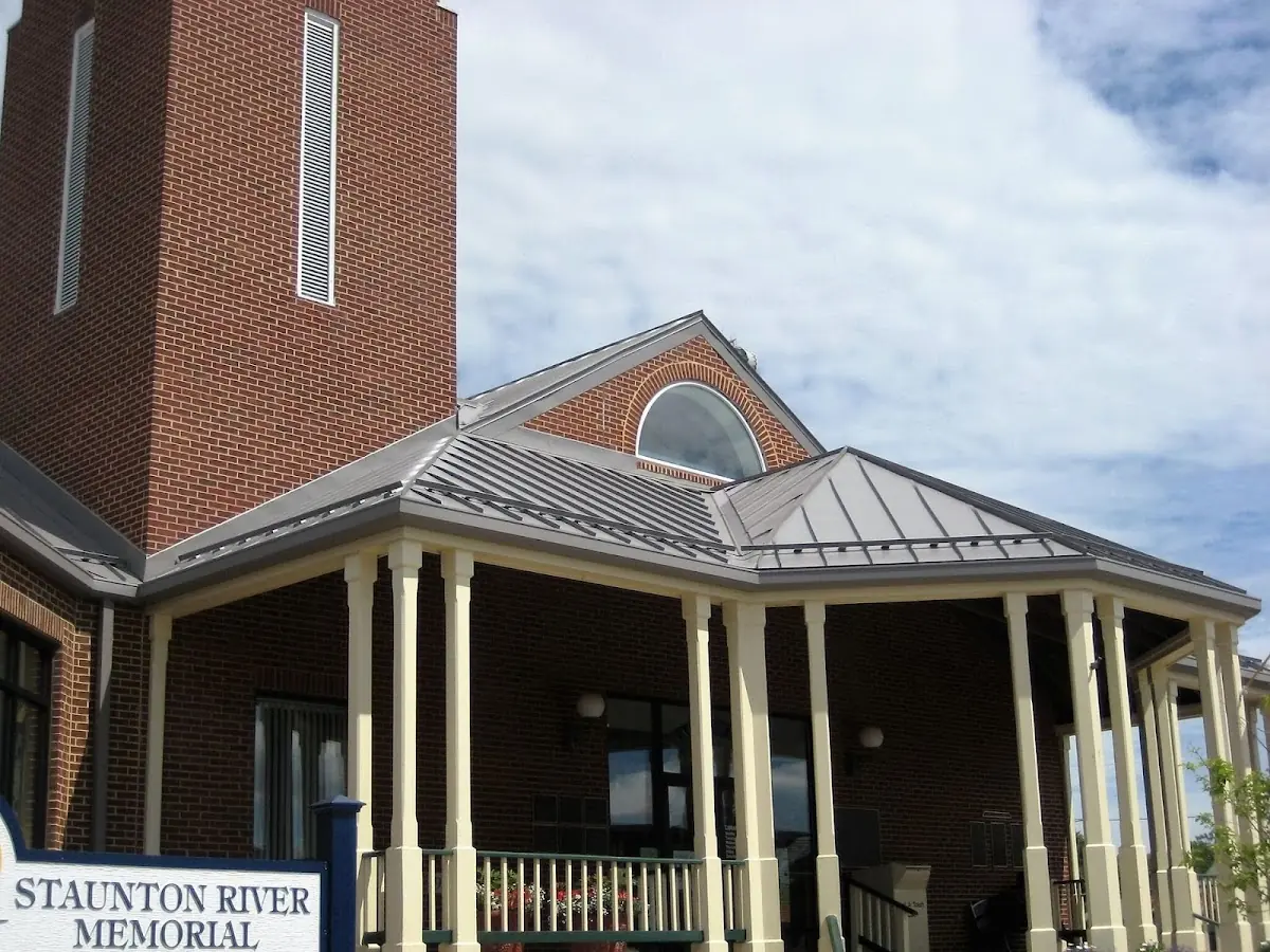 Skilled roofing craftsmen working on a residential roof in Livingston